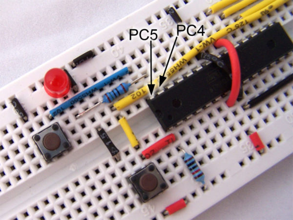 atmega8 on breadboard with switch and LED